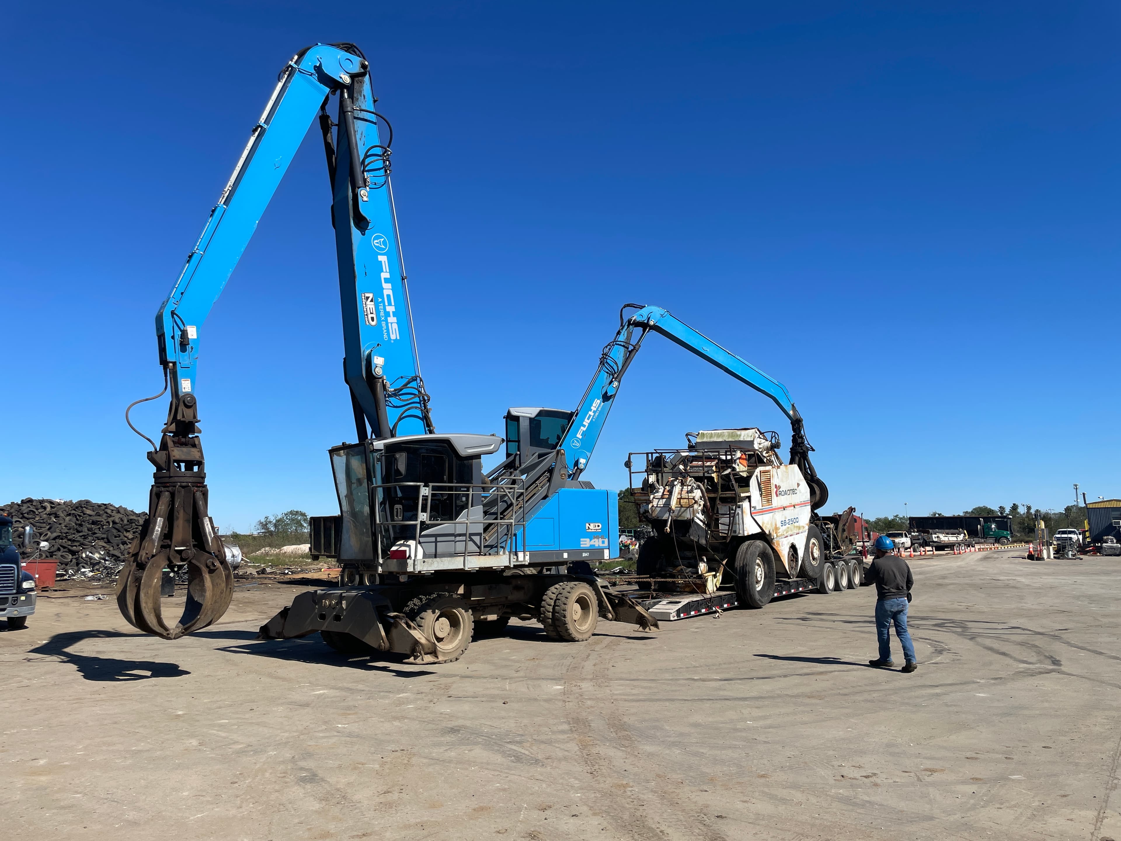 Heavy equipment unloading at Scrapworks Industrial facility